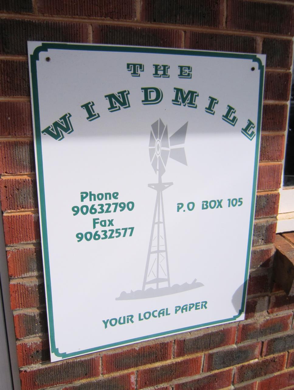 Windmill Newspaper Sign
